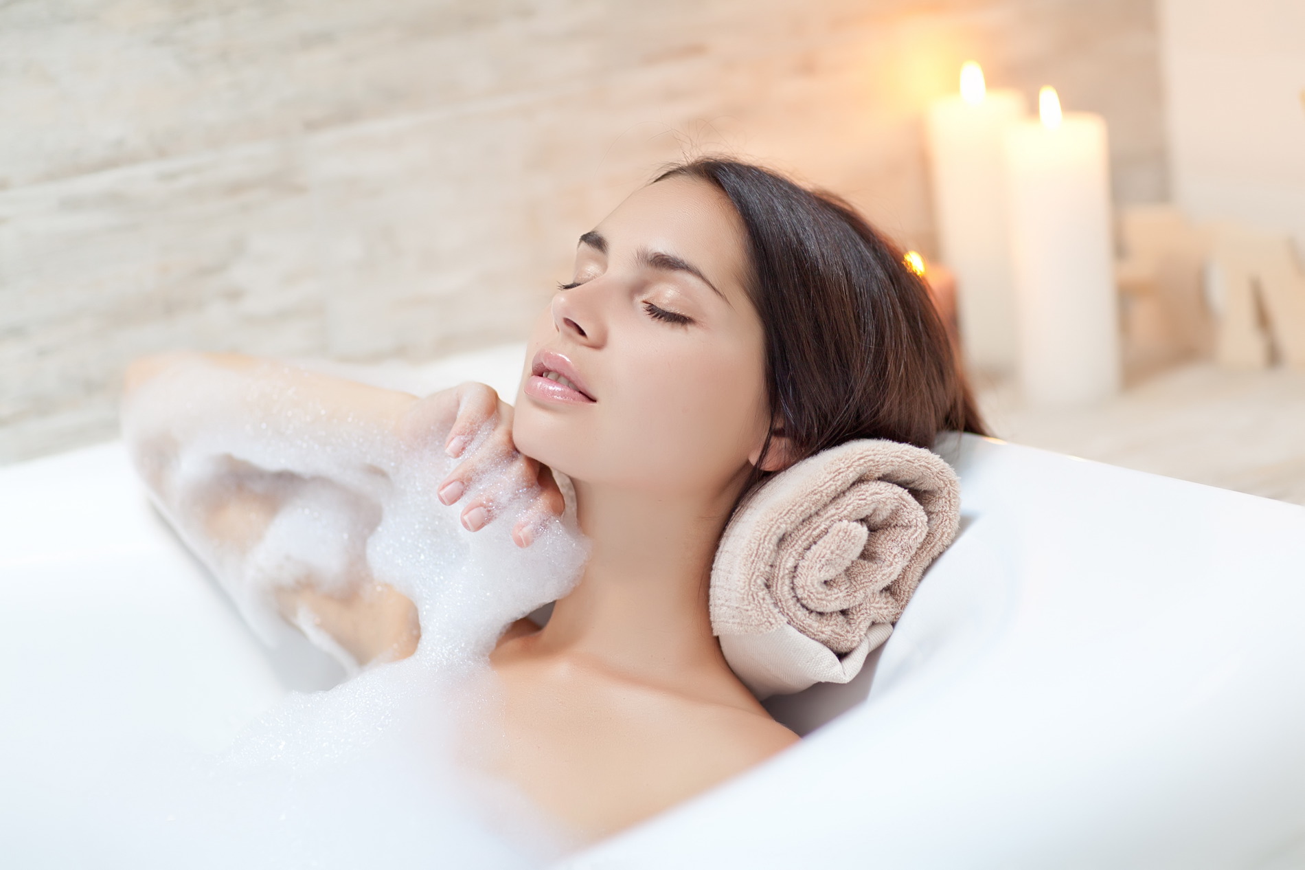 Woman relaxing in a bath