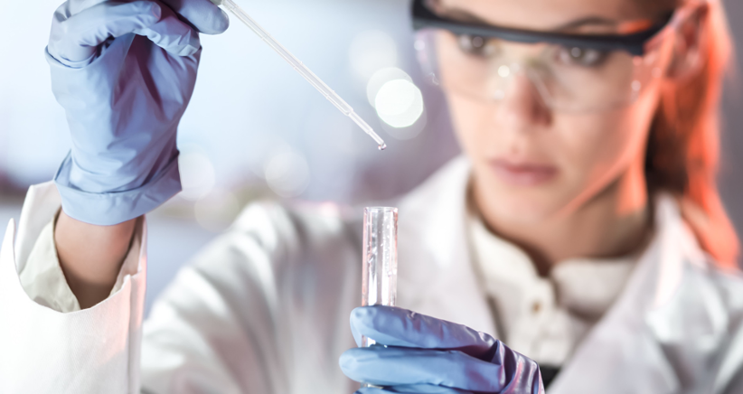 Scientist mixing pharmaceutical ingredients in an application laboratory