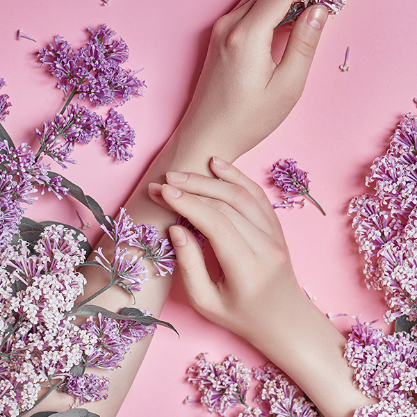 Healthy hands looking well taken care of on a pink background