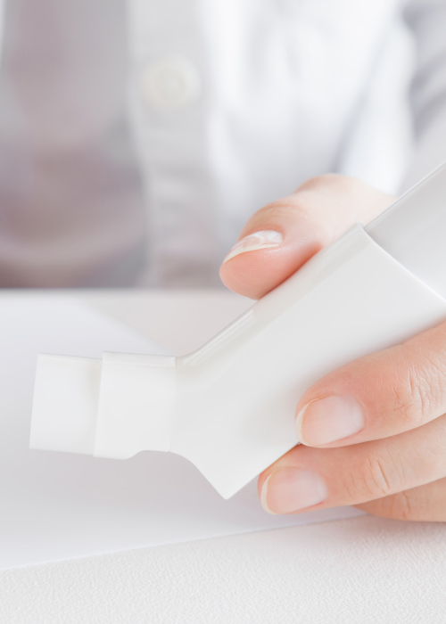 Doctor holding a dry powder inhaler